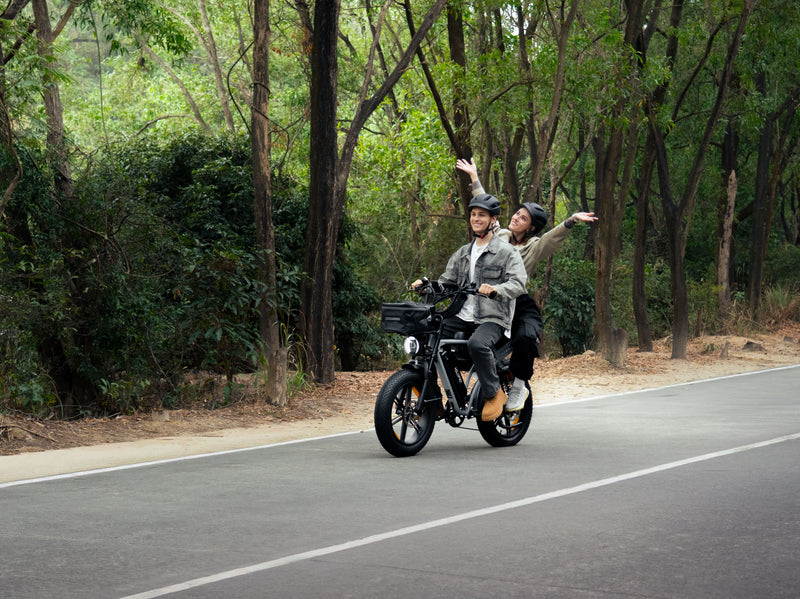 VELOPRO M9 electric bike riding on a forest road